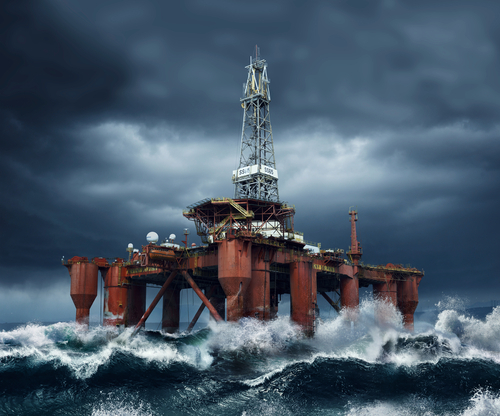 Offshore Oil Platform standing in the middle of ocean sea water